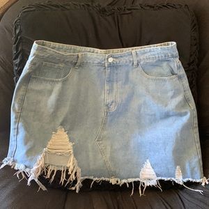 Distressed denim mini skirt